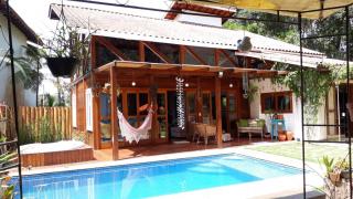 Bertioga: Casa linda na praia, condom&iacute;nio p&eacute; na areia - Piscina e Hidromassagem 1